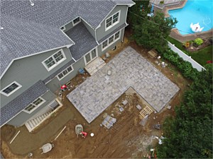 nicolock granite city alpine smooth cambridge onyx l shape patio drone  aerial view paver brick_1